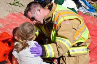 fireman with young girl