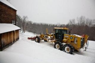 tractor plowing snow